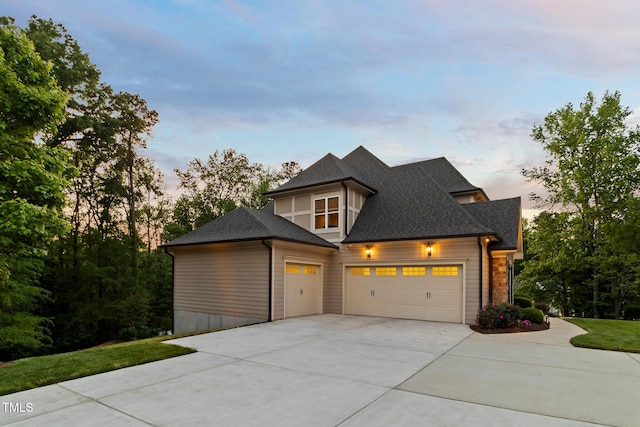 325 Forest Bridge Rd, Youngsville, NC 27596 - view of front of home featuring a garage, driveway, and roof with shingles