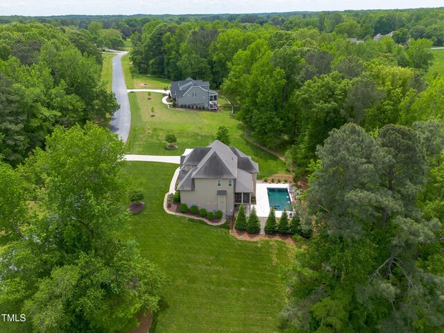 325 Forest Bridge Rd, Youngsville, NC 27596 - aerial view of property and surrounding area featuring a forest and a pool area