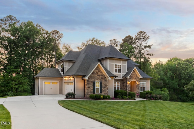 325 Forest Bridge Rd, Youngsville, NC 27596 - view of front of house featuring stone siding, concrete driveway, an attached garage, a front yard, and roof with shingles
