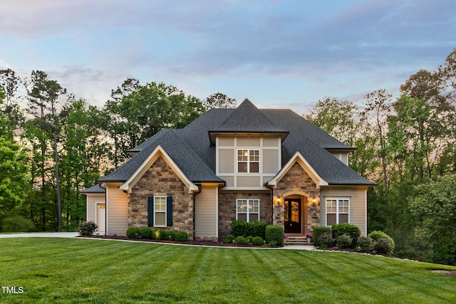 325 Forest Bridge Rd, Youngsville, NC 27596 - view of front facade with stone siding, a front lawn, and a shingled roof