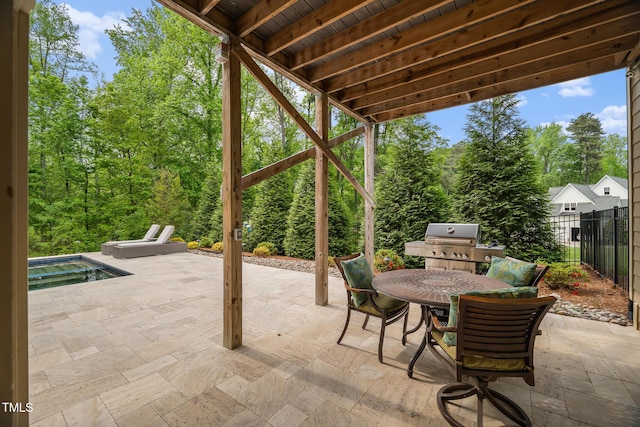325 Forest Bridge Rd, Youngsville, NC 27596 - view of patio / terrace featuring area for grilling, outdoor dining space, and a hot tub