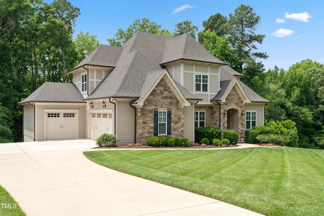 325 Forest Bridge Rd, Youngsville, NC 27596 - view of front facade with stone siding, a garage, concrete driveway, roof with shingles, and a front lawn