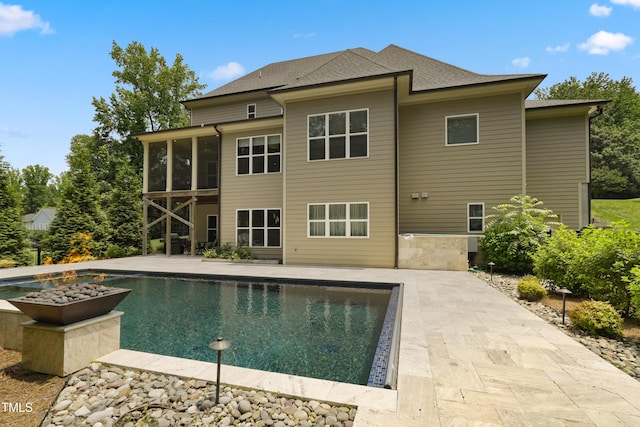 325 Forest Bridge Rd, Youngsville, NC 27596 - swimming pool with a sunroom and a patio