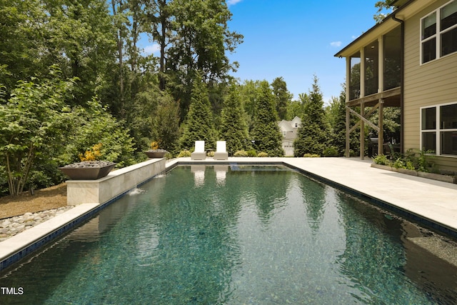 325 Forest Bridge Rd, Youngsville, NC 27596 - outdoor pool with a patio area and a sunroom