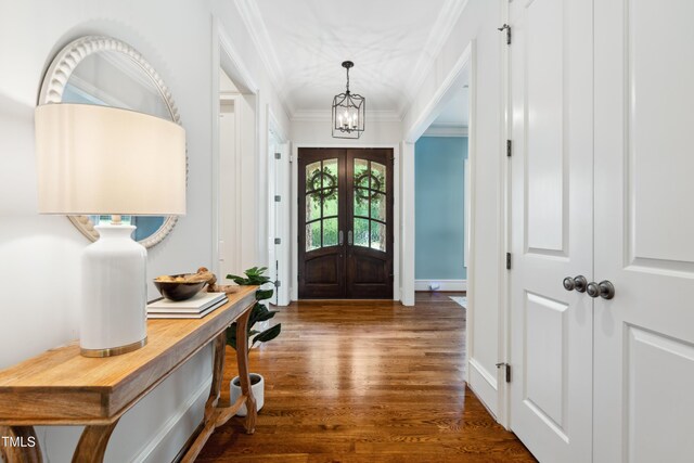 325 Forest Bridge Rd, Youngsville, NC 27596 - foyer entrance with french doors, dark wood-style floors, a chandelier, and crown molding