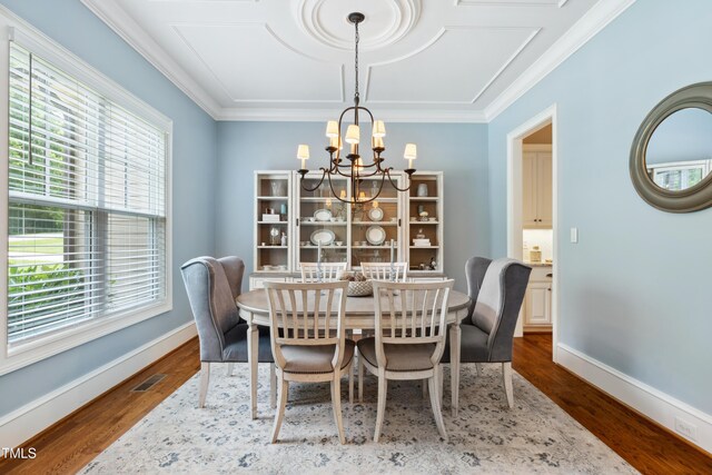 325 Forest Bridge Rd, Youngsville, NC 27596 - dining room featuring a chandelier, dark wood-style flooring, baseboards, and ornamental molding
