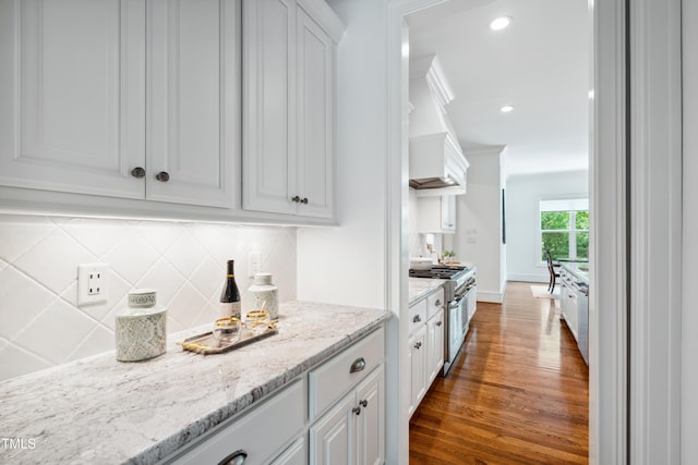 325 Forest Bridge Rd, Youngsville, NC 27596 - kitchen featuring double oven range, dark wood-style flooring, decorative backsplash, white cabinetry, and recessed lighting