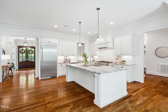 325 Forest Bridge Rd, Youngsville, NC 27596 - kitchen with stainless steel built in fridge, a sink, a center island with sink, white cabinetry, and crown molding