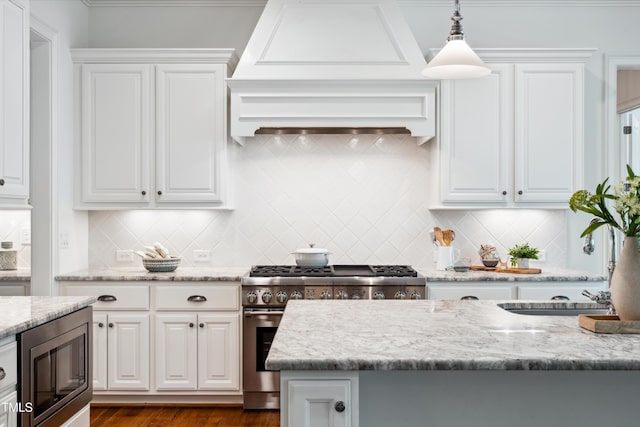 325 Forest Bridge Rd, Youngsville, NC 27596 - kitchen featuring stainless steel appliances, white cabinetry, tasteful backsplash, and hanging light fixtures