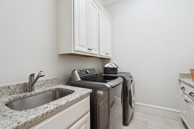 325 Forest Bridge Rd, Youngsville, NC 27596 - washroom with cabinet space, washing machine and dryer, and baseboards