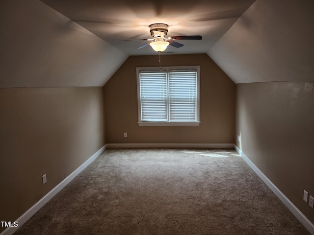 additional living space featuring a ceiling fan, carpet flooring, lofted ceiling, and baseboards