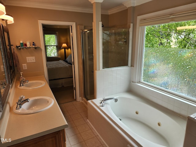 ensuite bathroom featuring a shower stall, a tub with jets, ornamental molding, tile patterned floors, and double vanity