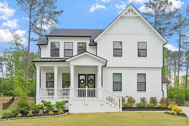 7616 Hasentree Way, Wake Forest, NC 27587 - modern inspired farmhouse with fence, board and batten siding, a porch, and a front lawn
