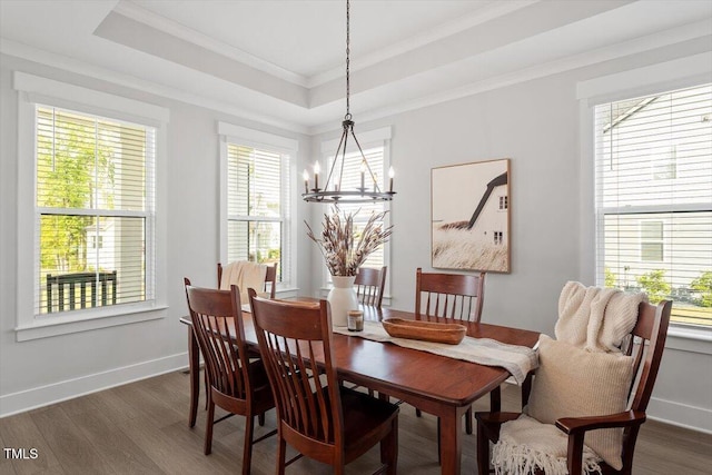 7616 Hasentree Way, Wake Forest, NC 27587 - dining area with crown molding, an inviting chandelier, baseboards, dark wood-type flooring, and a tray ceiling