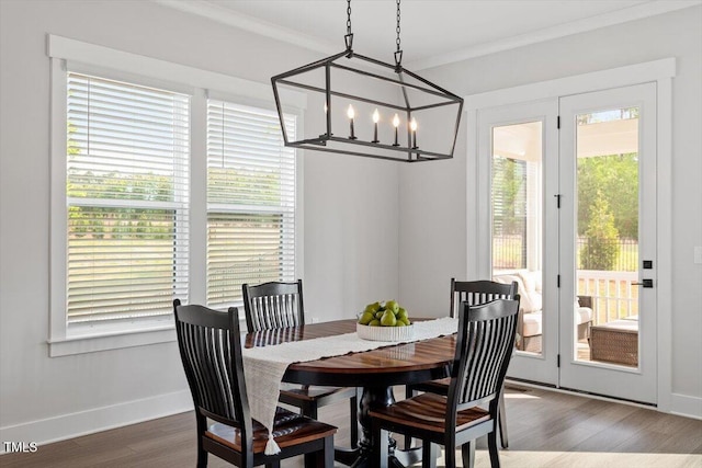 7616 Hasentree Way, Wake Forest, NC 27587 - dining room with an inviting chandelier, crown molding, dark wood finished floors, and a wealth of natural light