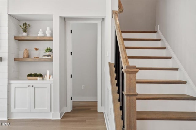 7616 Hasentree Way, Wake Forest, NC 27587 - stairs featuring baseboards and wood finished floors
