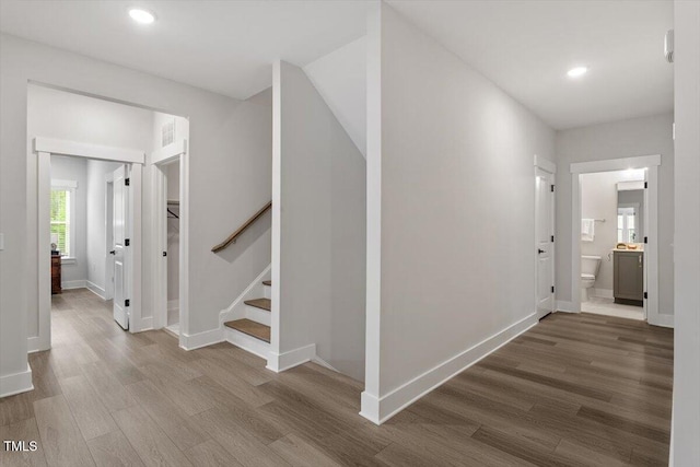7616 Hasentree Way, Wake Forest, NC 27587 - hall featuring stairway, baseboards, recessed lighting, and wood finished floors