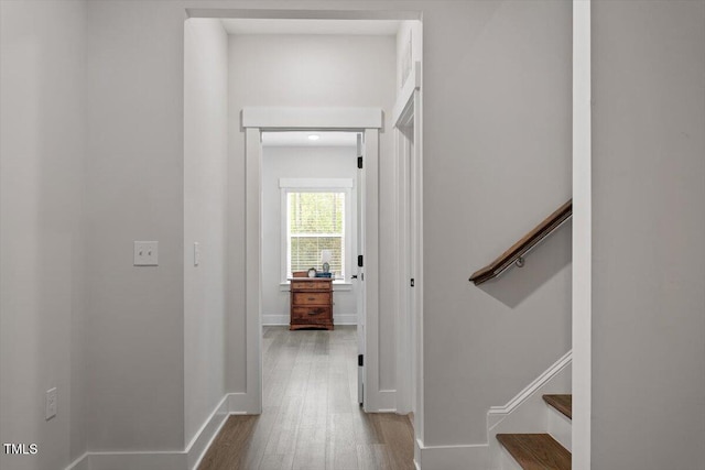 7616 Hasentree Way, Wake Forest, NC 27587 - hall featuring baseboards, stairs, and wood finished floors
