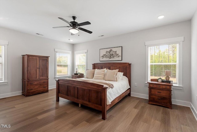7616 Hasentree Way, Wake Forest, NC 27587 - bedroom featuring a ceiling fan, visible vents, light wood-type flooring, baseboards, and recessed lighting