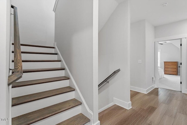 7616 Hasentree Way, Wake Forest, NC 27587 - stairway featuring baseboards and wood finished floors