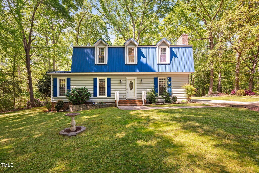 3312 Shannon Cir, Apex, NC 27539 - view of front of home featuring a chimney and a front yard