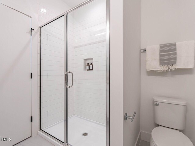 1317 Garner Rd Unit 101, Raleigh, NC 27610 - bathroom featuring toilet and a stall shower