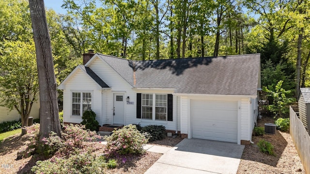 2941 Golden Oak Ct, Raleigh, NC 27603 - single story home featuring a chimney, a shingled roof, a garage, and concrete driveway