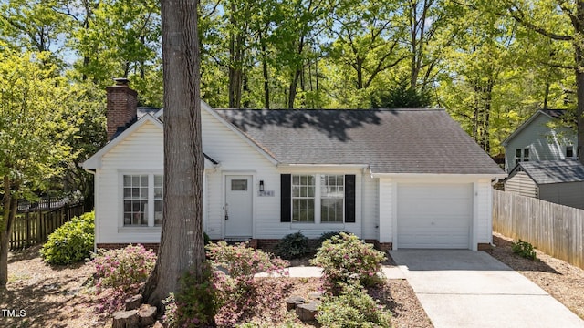 2941 Golden Oak Ct, Raleigh, NC 27603 - view of front of property featuring an attached garage, a shingled roof, concrete driveway, and fence