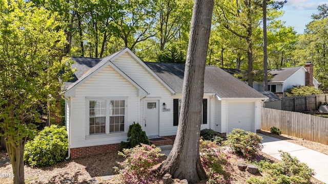 2941 Golden Oak Ct, Raleigh, NC 27603 - single story home featuring a shingled roof, driveway, fence, and an attached garage