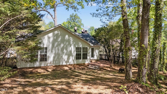2941 Golden Oak Ct, Raleigh, NC 27603 - view of side of property featuring fence and a chimney