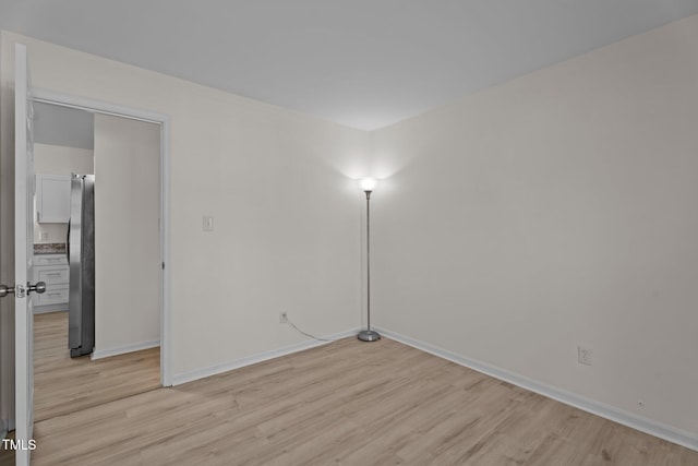 2941 Golden Oak Ct, Raleigh, NC 27603 - unfurnished room with light wood-style floors and baseboards