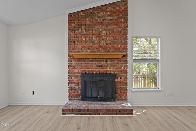 2941 Golden Oak Ct, Raleigh, NC 27603 - unfurnished living room featuring wood finished floors, a fireplace, and baseboards