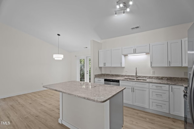 2941 Golden Oak Ct, Raleigh, NC 27603 - kitchen featuring visible vents, a center island, dishwasher, a sink, and lofted ceiling