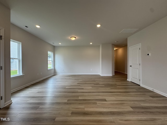 168 Bruce Dr, Dunn, NC 28334 - unfurnished room with wood finished floors and recessed lighting