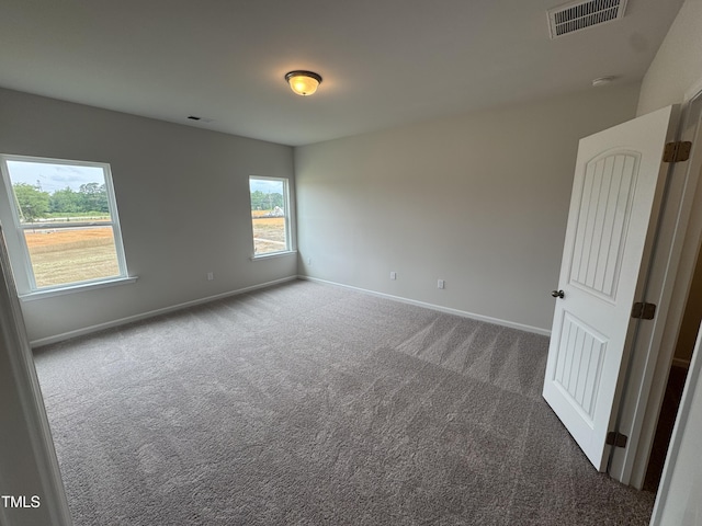 168 Bruce Dr, Dunn, NC 28334 - empty room with carpet flooring and a smoke detector