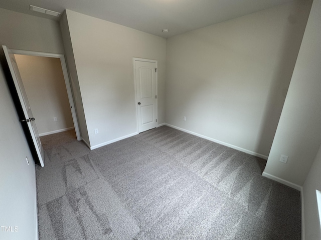 168 Bruce Dr, Dunn, NC 28334 - unfurnished bedroom with carpet floors and baseboards