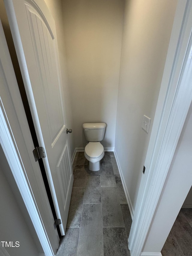 168 Bruce Dr, Dunn, NC 28334 - bathroom with toilet and baseboards
