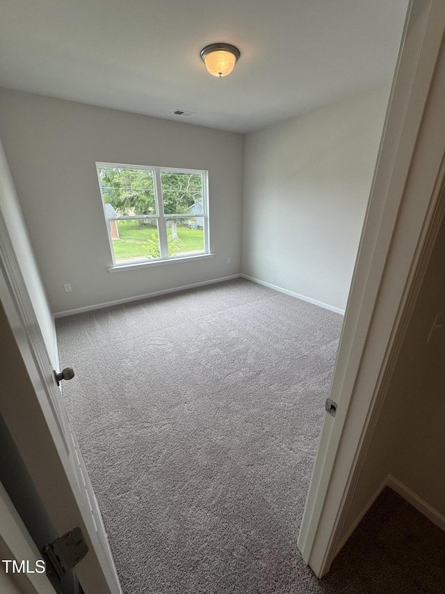 168 Bruce Dr, Dunn, NC 28334 - carpeted empty room featuring baseboards
