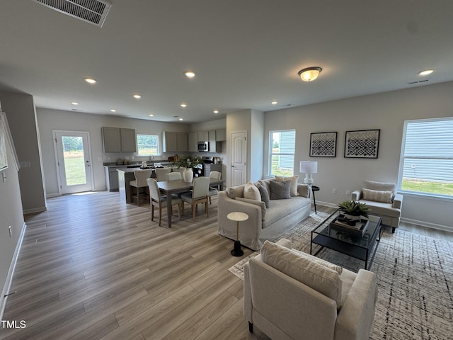 168 Bruce Dr, Dunn, NC 28334 - living area with light wood-style flooring and recessed lighting