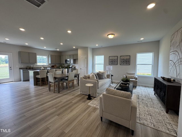 168 Bruce Dr, Dunn, NC 28334 - living room with plenty of natural light, recessed lighting, and light wood-type flooring