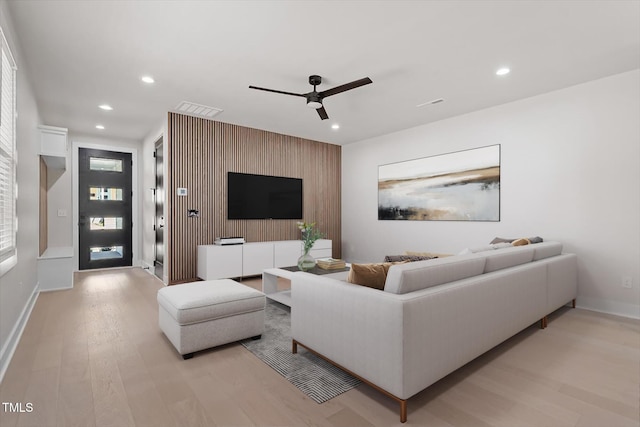 730 Hopkins St, Durham, NC 27701 - living room with an accent wall, light wood-style floors, ceiling fan, recessed lighting, and baseboards