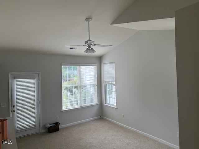1116 Silky Dogwood Trl, Apex, NC 27502 - spare room featuring vaulted ceiling, baseboards, ceiling fan, and carpet flooring