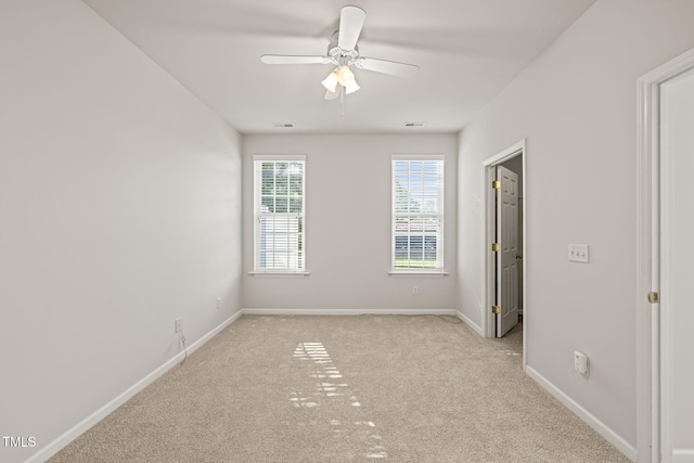 1116 Silky Dogwood Trl, Apex, NC 27502 - unfurnished room with baseboards, light carpet, and ceiling fan