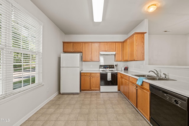 1116 Silky Dogwood Trl, Apex, NC 27502 - kitchen with a sink, white appliances, light countertops, baseboards, and under cabinet range hood