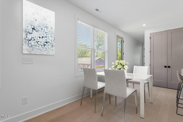 dining area with visible vents, recessed lighting, light wood finished floors, and baseboards