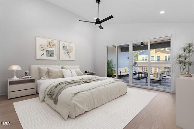 bedroom with high vaulted ceiling, access to outside, recessed lighting, and wood finished floors
