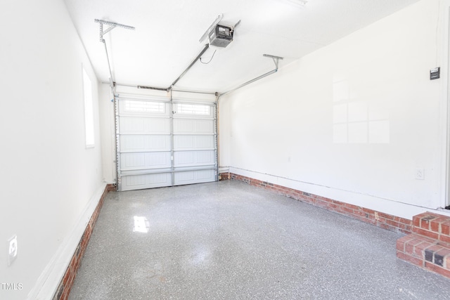 162 Valley Rd, Warrenton, NC 27589 - garage featuring baseboards and a garage door opener