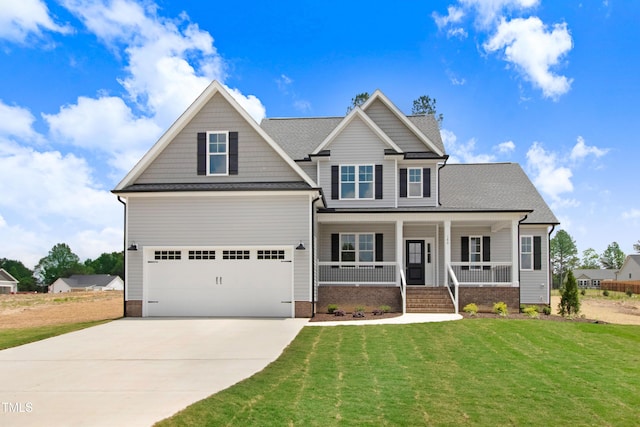 186 Gumtop Dr, Zebulon, NC 27597 - craftsman-style house featuring covered porch, concrete driveway, a front yard, and a garage