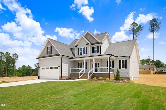 186 Gumtop Dr, Zebulon, NC 27597 - view of front of property with covered porch, concrete driveway, a front yard, and a garage