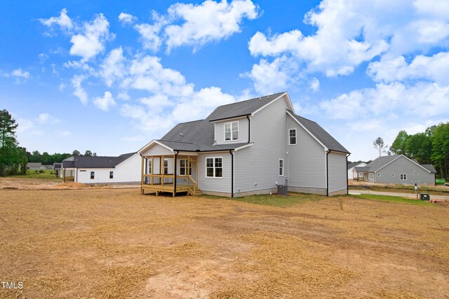 186 Gumtop Dr, Zebulon, NC 27597 - back of house featuring a wooden deck and roof with shingles